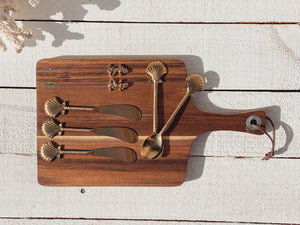 small wooden cheese board paddle