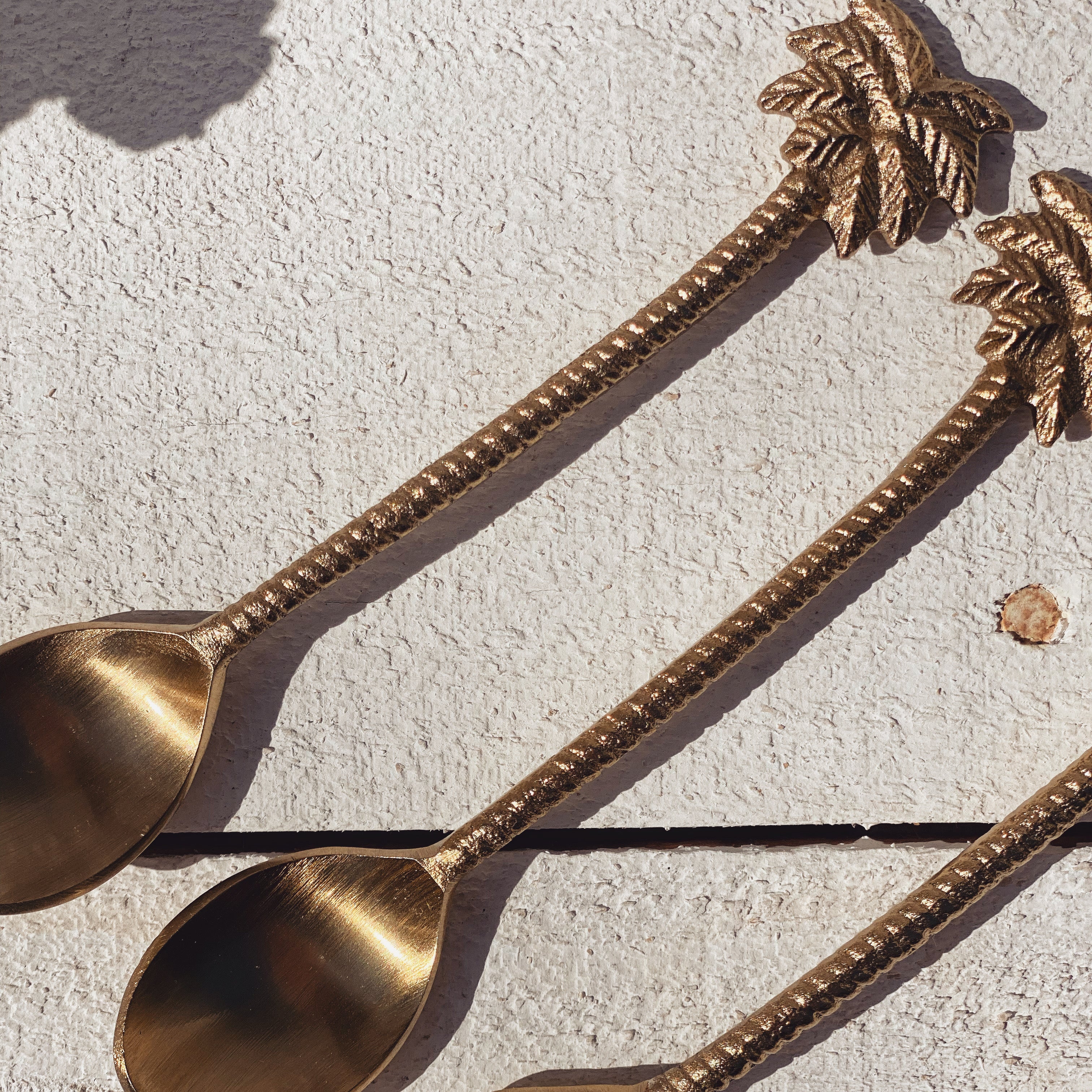 gold palm tree spoon